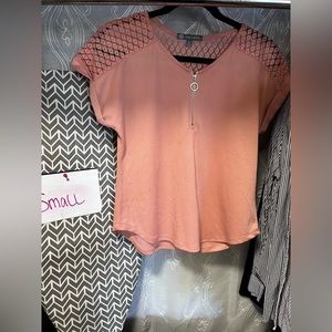 Coral/pink top with lace shoulders